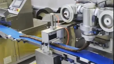 Double Filling Encrusting Machine with Cutter and Panner for Making Nut Bar at Saudi Arabia Customer's Plant in 2021